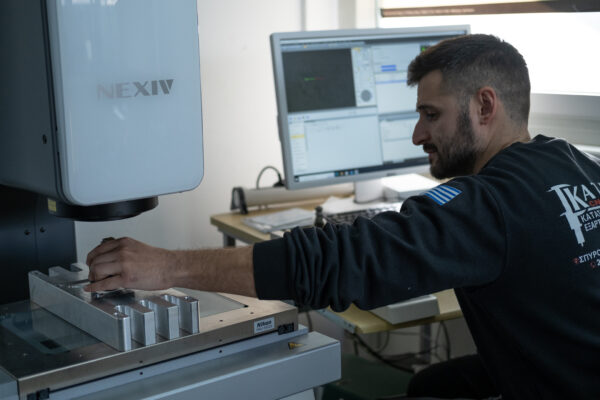 An operative using Nikon Metrology's NEXIV VMZ video measuring system at Kataras CNC Machining, Acharnes, Greece - high accuracy, high speed measurement video measuring system