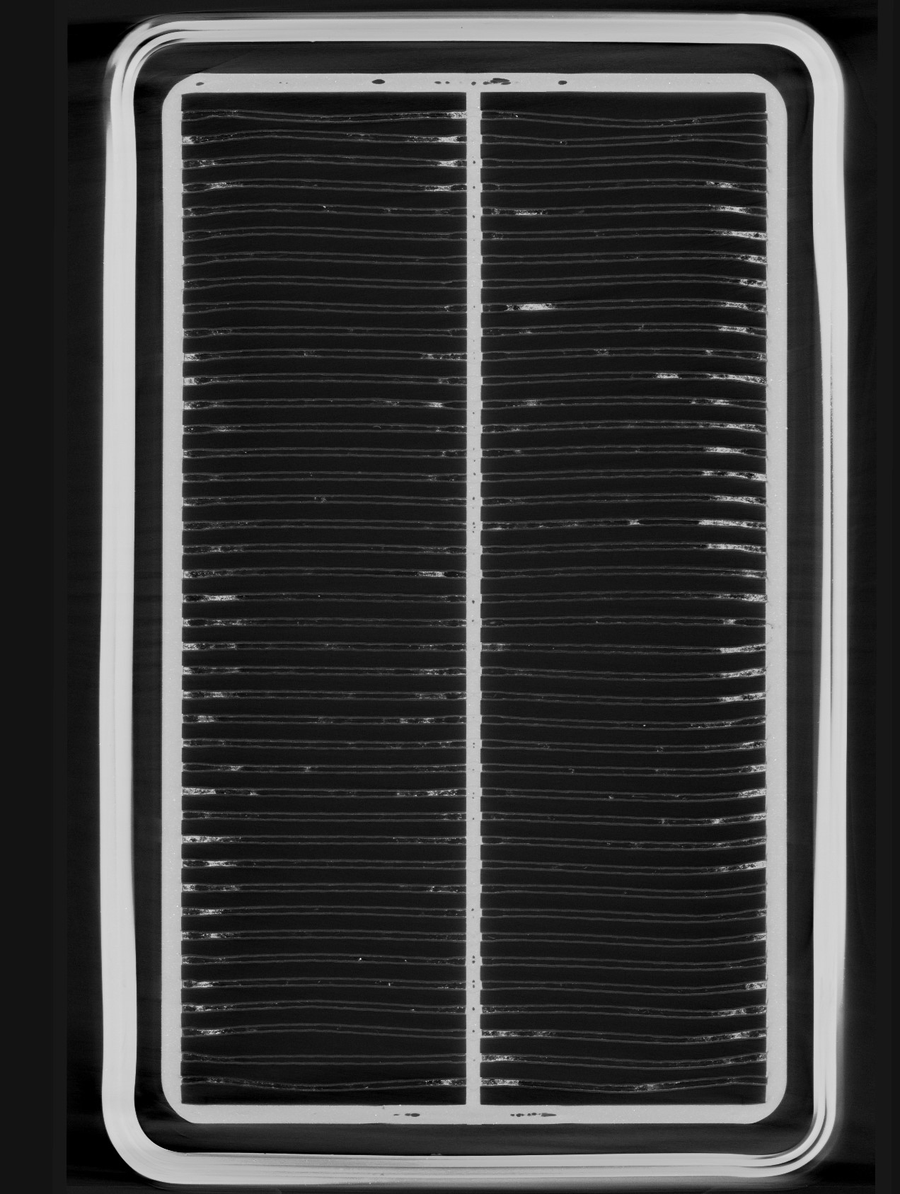 Scan of a used air filter where you can clearly see the impurities