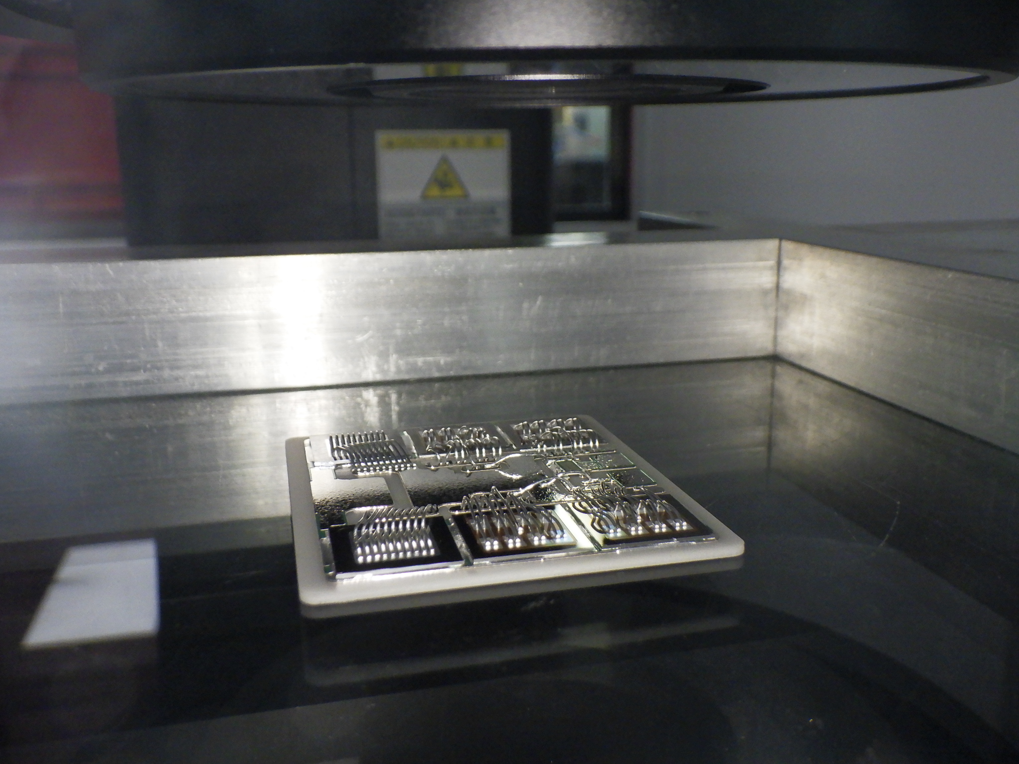 The substrate on which the electrical components are assembled under the NEXIV ready to be measured.