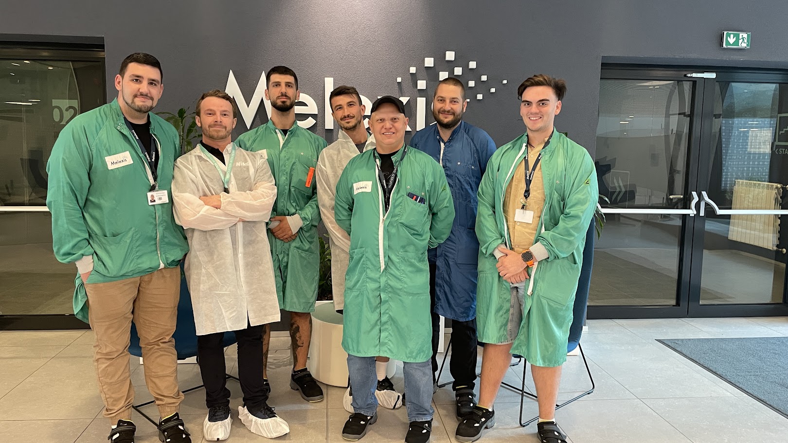 Thomas Hutchinson, second from the left, with customers at a recent training, all dressed up to enter a clean room.