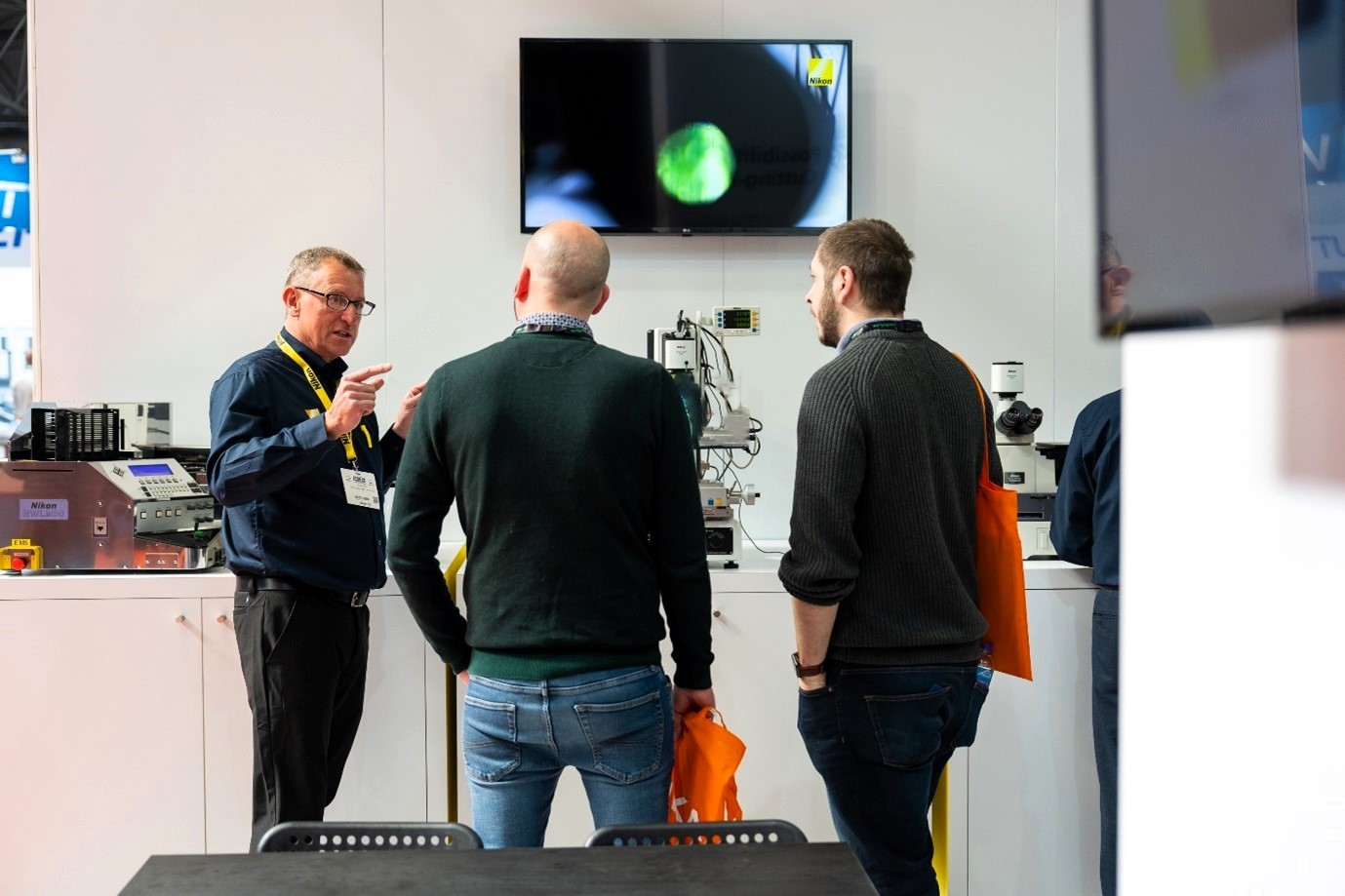 Spencer Smith, on the left, with visitors at an exhibition.