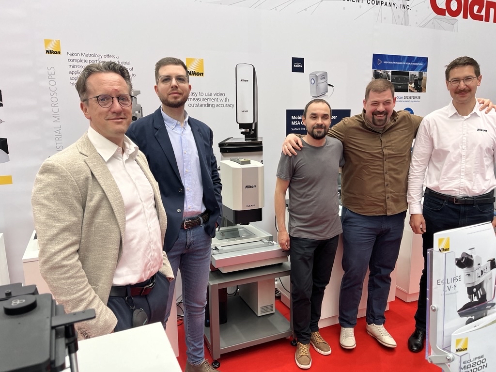 Martin Plechinger, on the left, with Resellers at a recent exhibition and other Nikon colleagues.